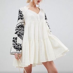 Free people flowy dress with black embroidery on sleeves